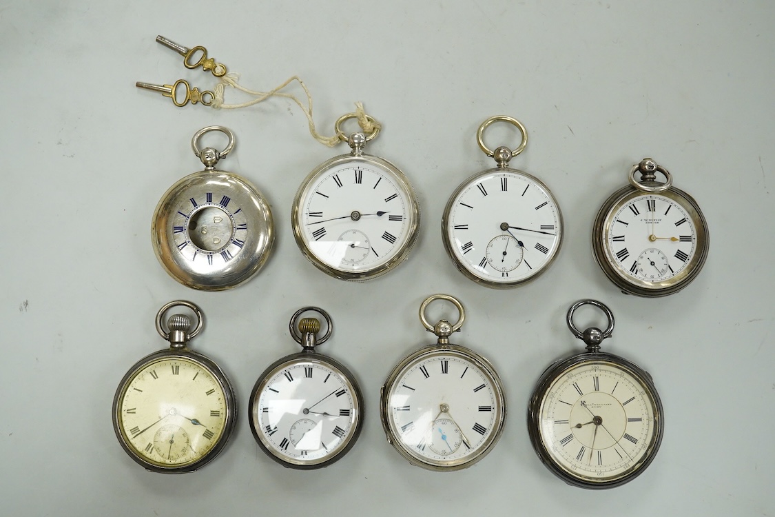 Seven assorted mainly early 20th century silver open faced pocket watches including a chronograph by William Williams of Bury, case diameter 53mm and one other silver pocket watch case(no movement).